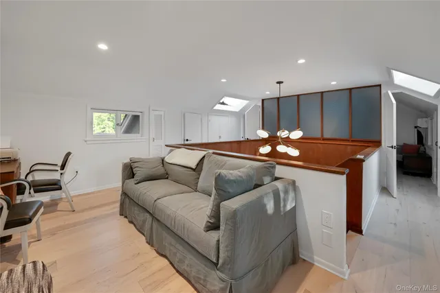 a view of a house with a balcony and wooden fence