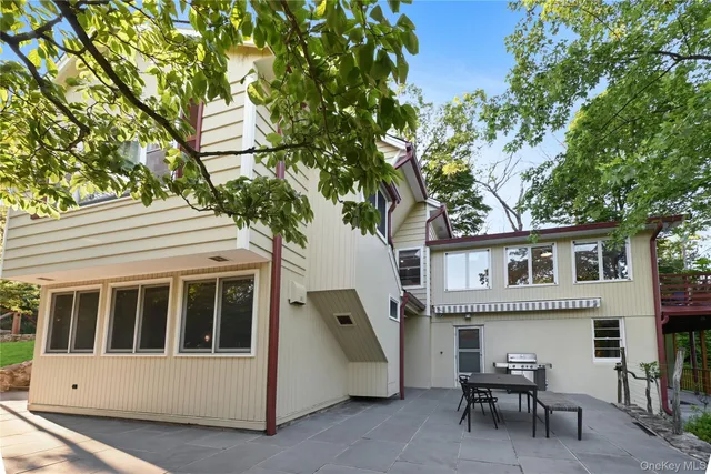 a view of a field with trees in the background