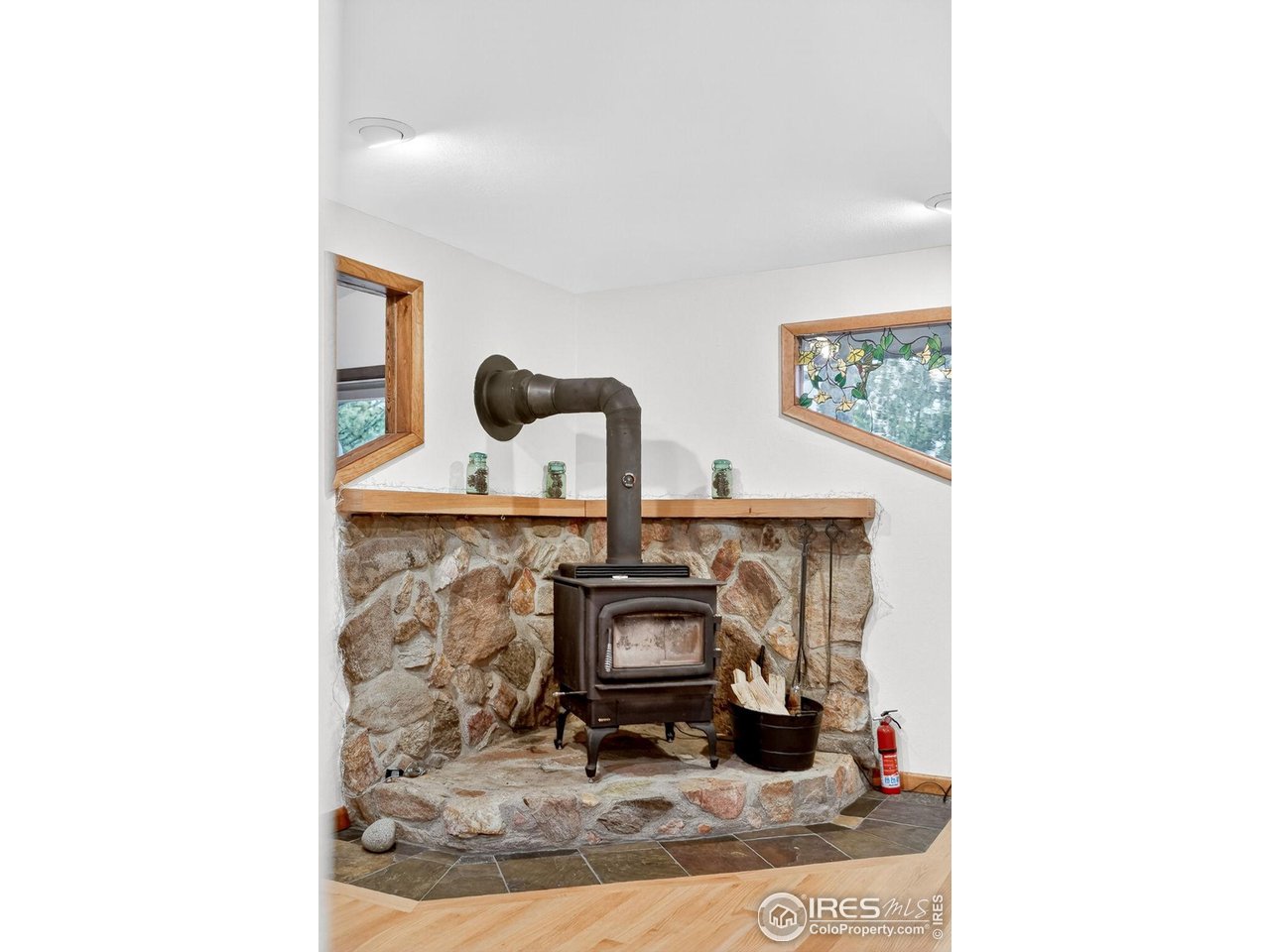 1707 Ridge Road Nederland, CO 80466 - Photo 15 of 50 VERY efficient wood-burning fireplace in Main floor Living Room/Family Room