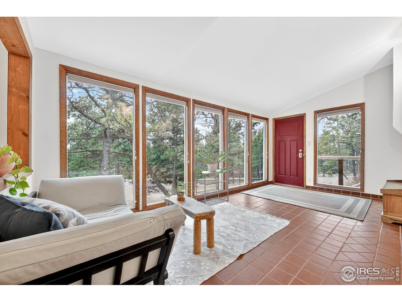 1707 Ridge Road Nederland, CO 80466 - Photo 6 of 50 Entry Bathed in Southeast exposure (morning light) with floor to ceiling windows
