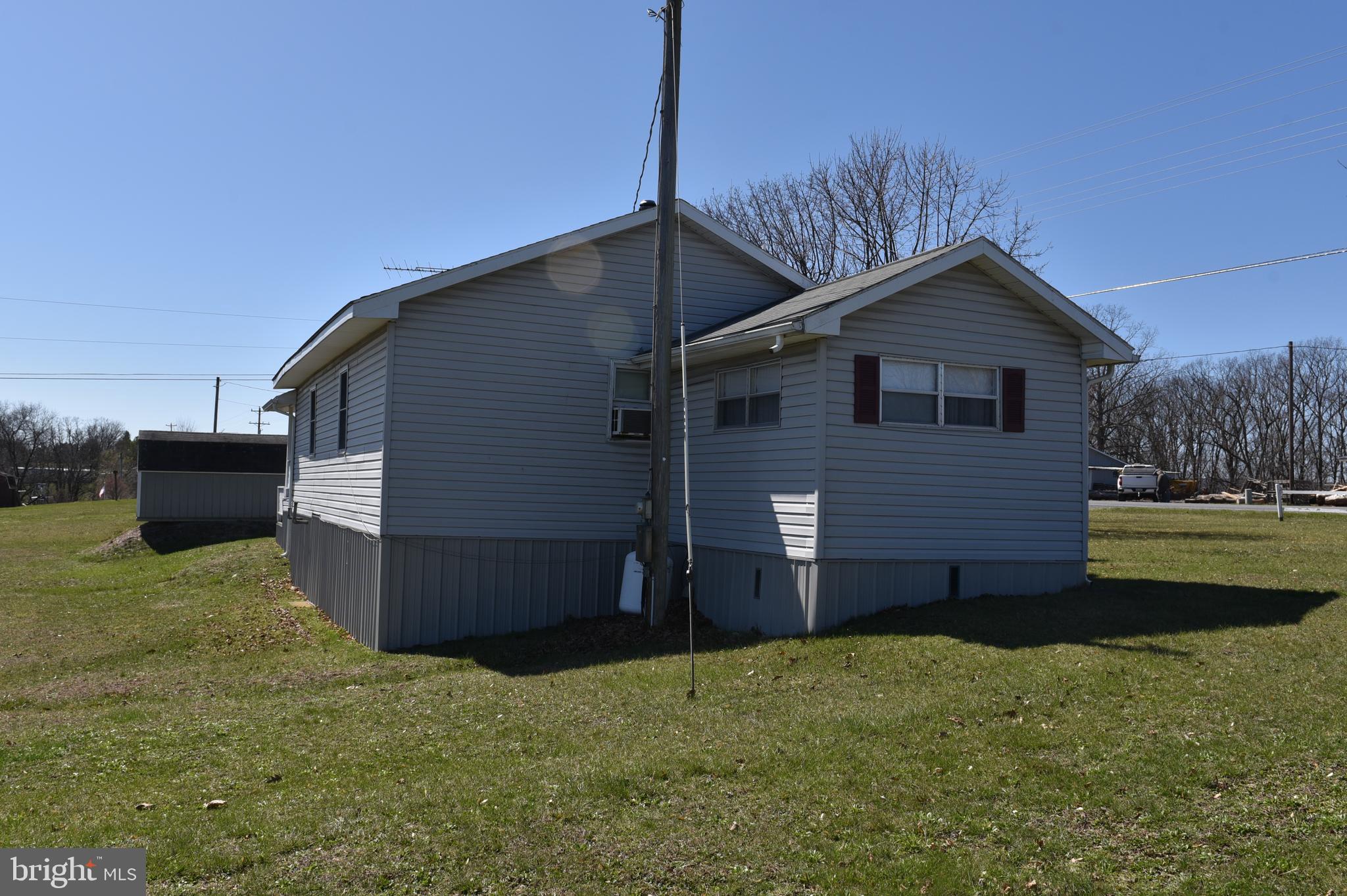 2764 North Clear Ridge Road Hustontown, PA 17229 - Photo 2 of 12 a view of a house with a yard