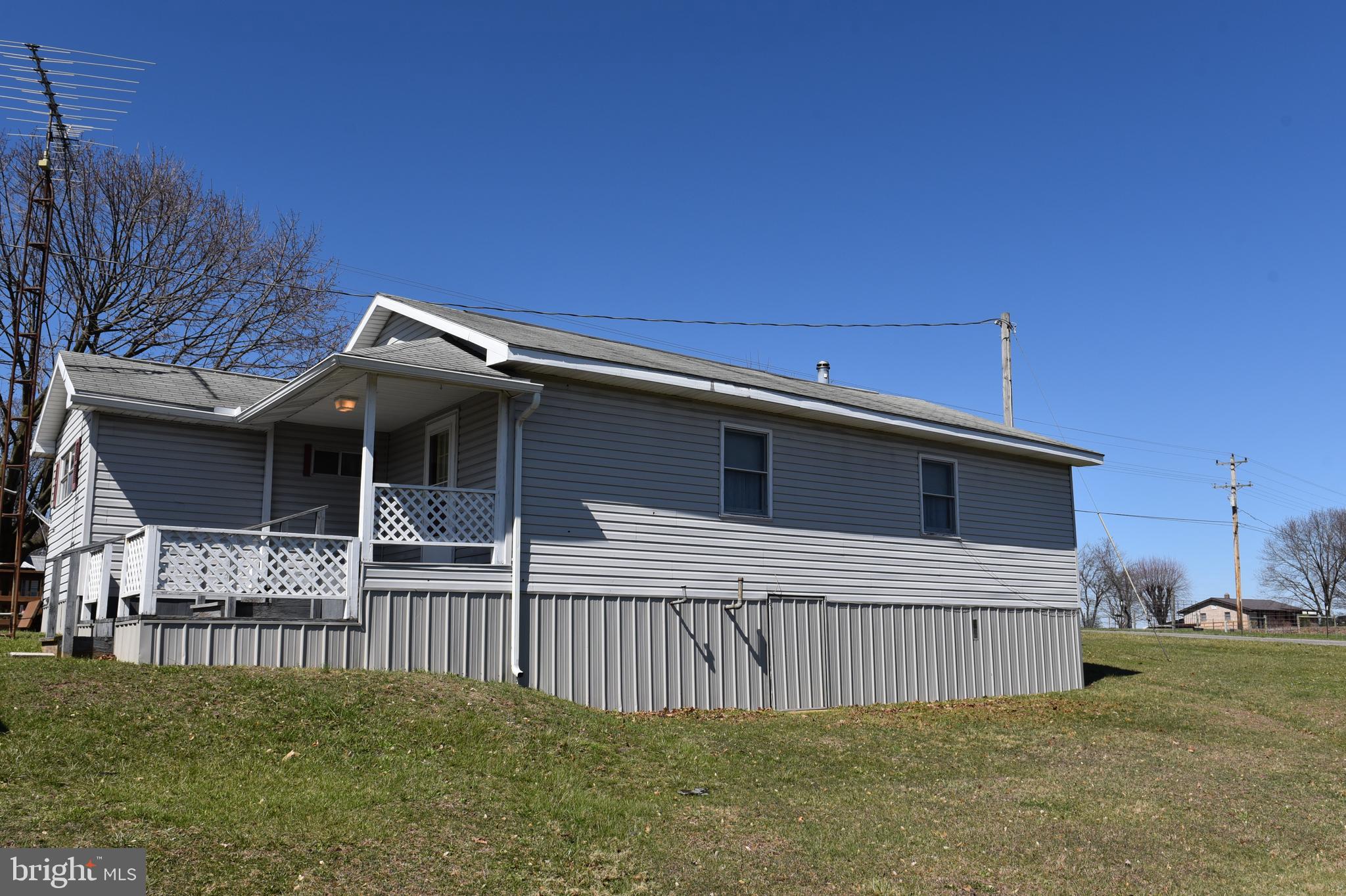 2764 North Clear Ridge Road Hustontown, PA 17229 - Photo 3 of 12 a view of a house with a backyard