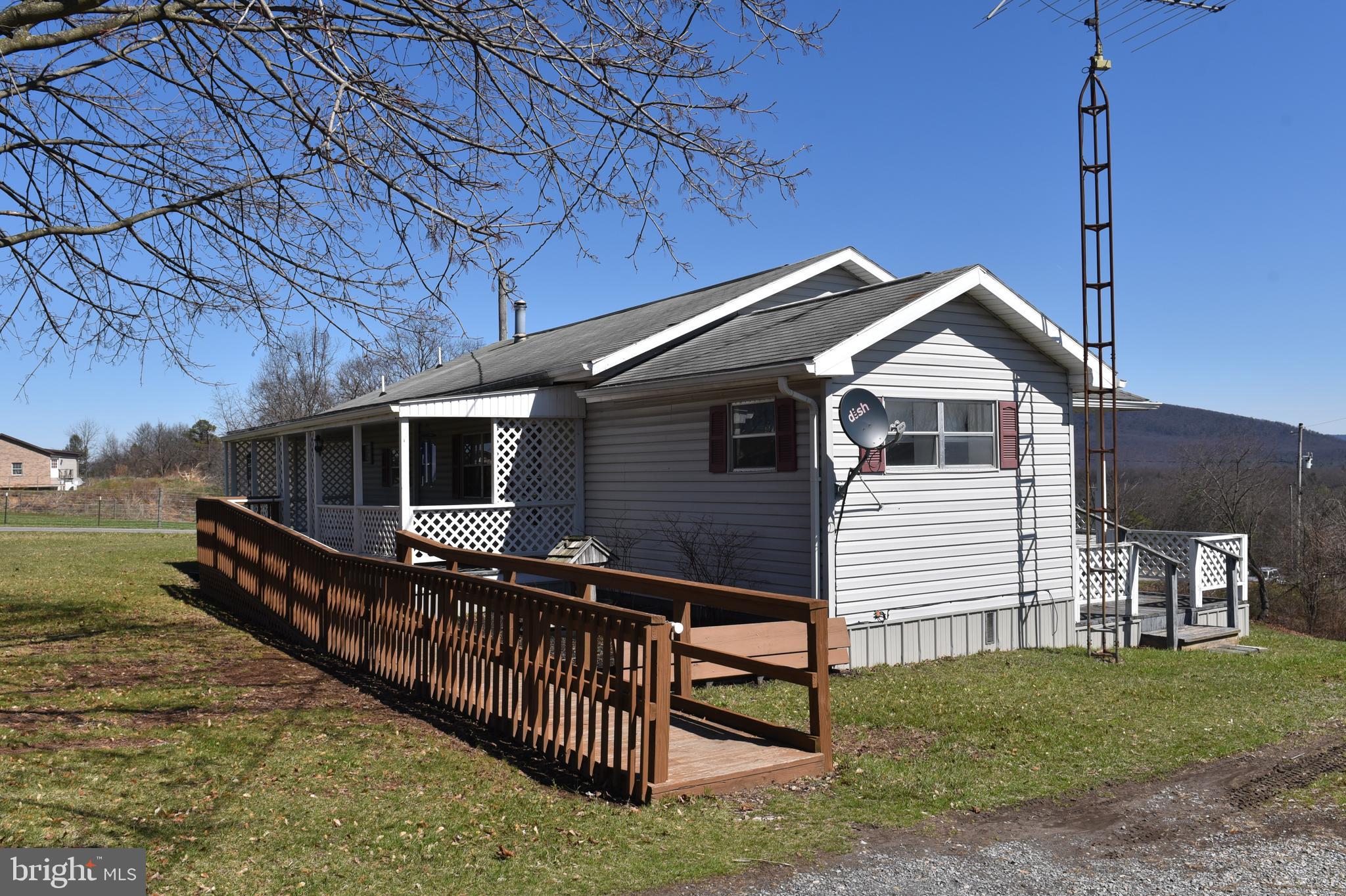 2764 North Clear Ridge Road Hustontown, PA 17229 - Photo 4 of 12 a front view of a house with balcony