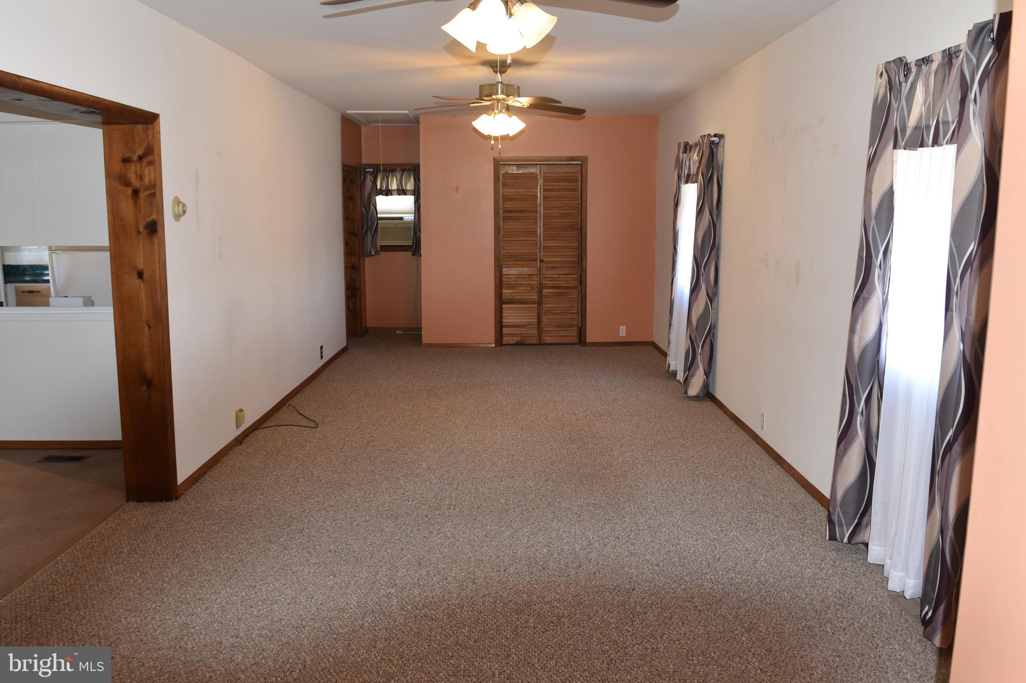 2764 North Clear Ridge Road Hustontown, PA 17229 - Photo 6 of 12 an empty room with closet and windows
