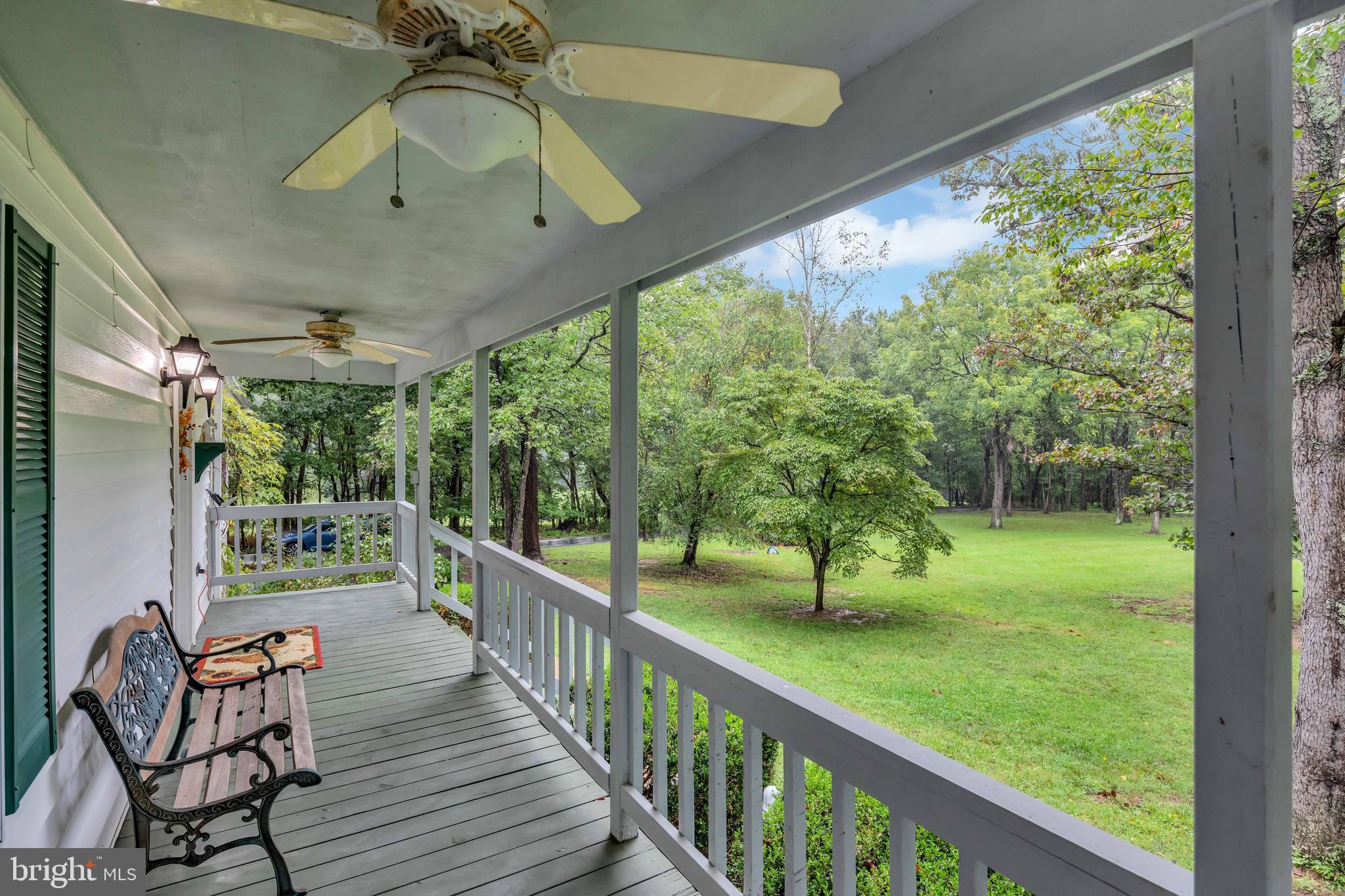 Front porch overlooking expansive yard.