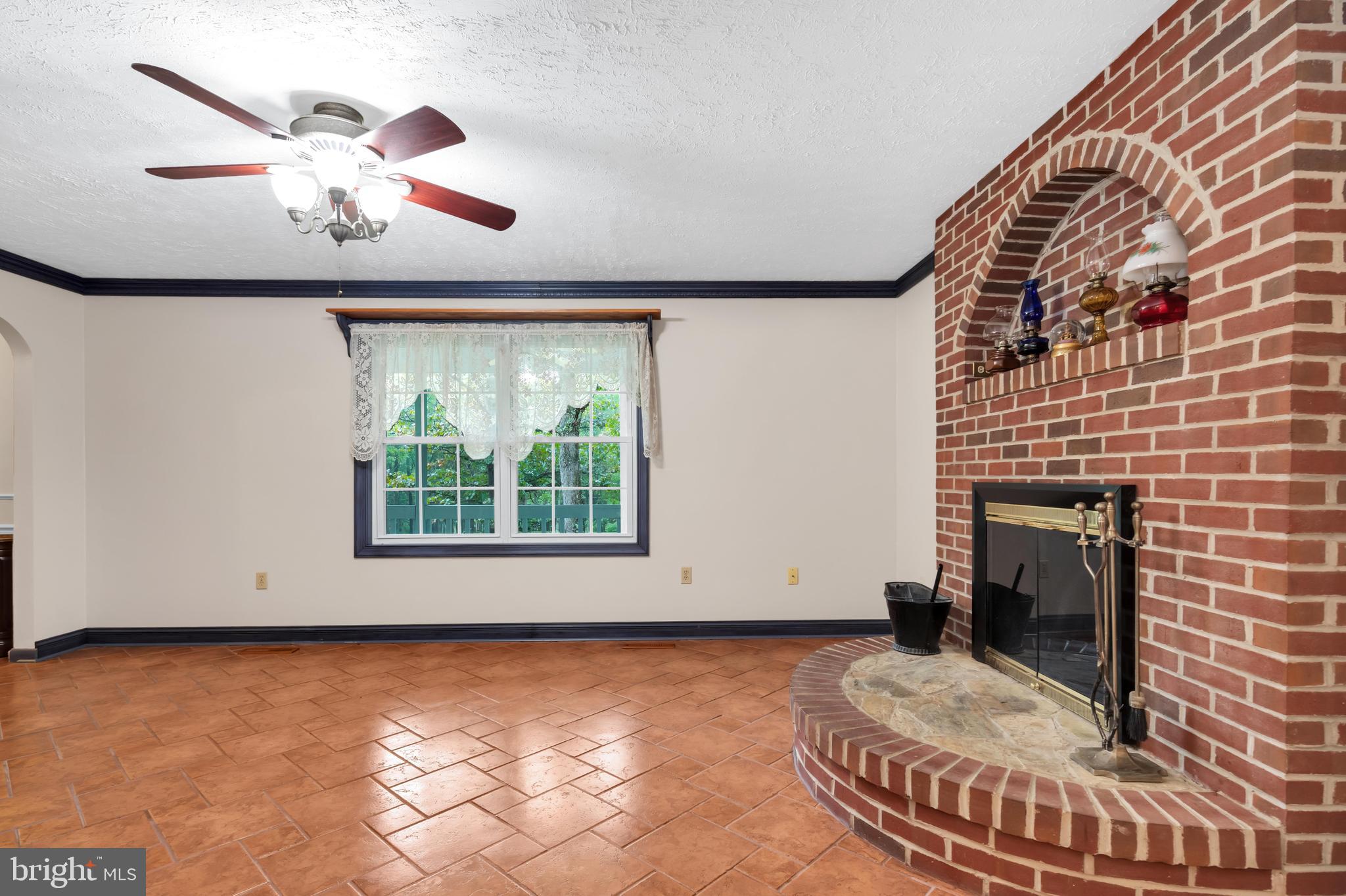 Living Room with brick fireplace.