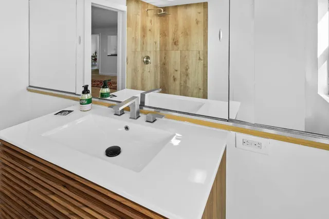 a bathroom with a tub and a sink