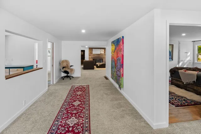 a bed room with furniture and a rug