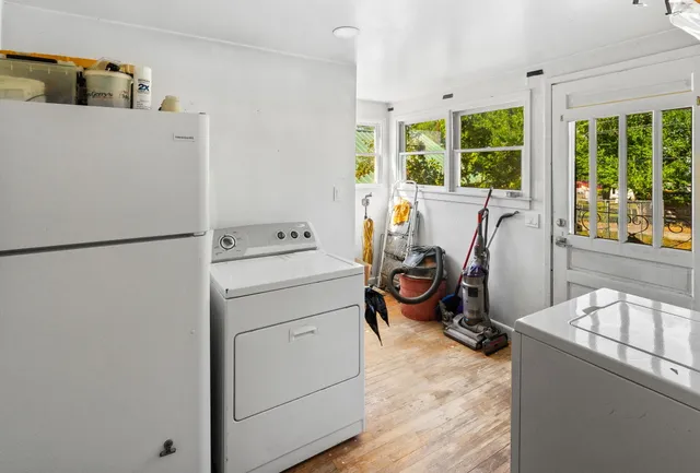 a view of a storage & utility room with washer and dryer