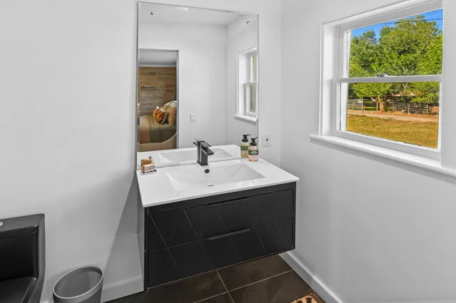 a bathroom with a sink and a mirror