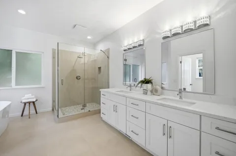 a bathroom with a bathtub and a shower