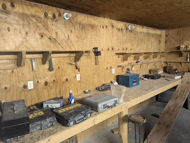 a kitchen with a table chairs and a stove top oven