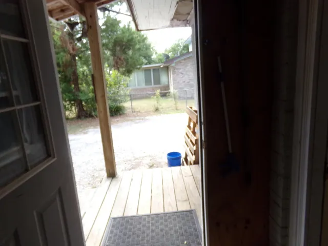 a view of balcony and wooden floor