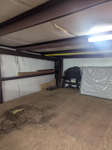 a view of backyard of house with trees