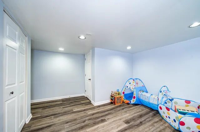 a bedroom with bed and a window