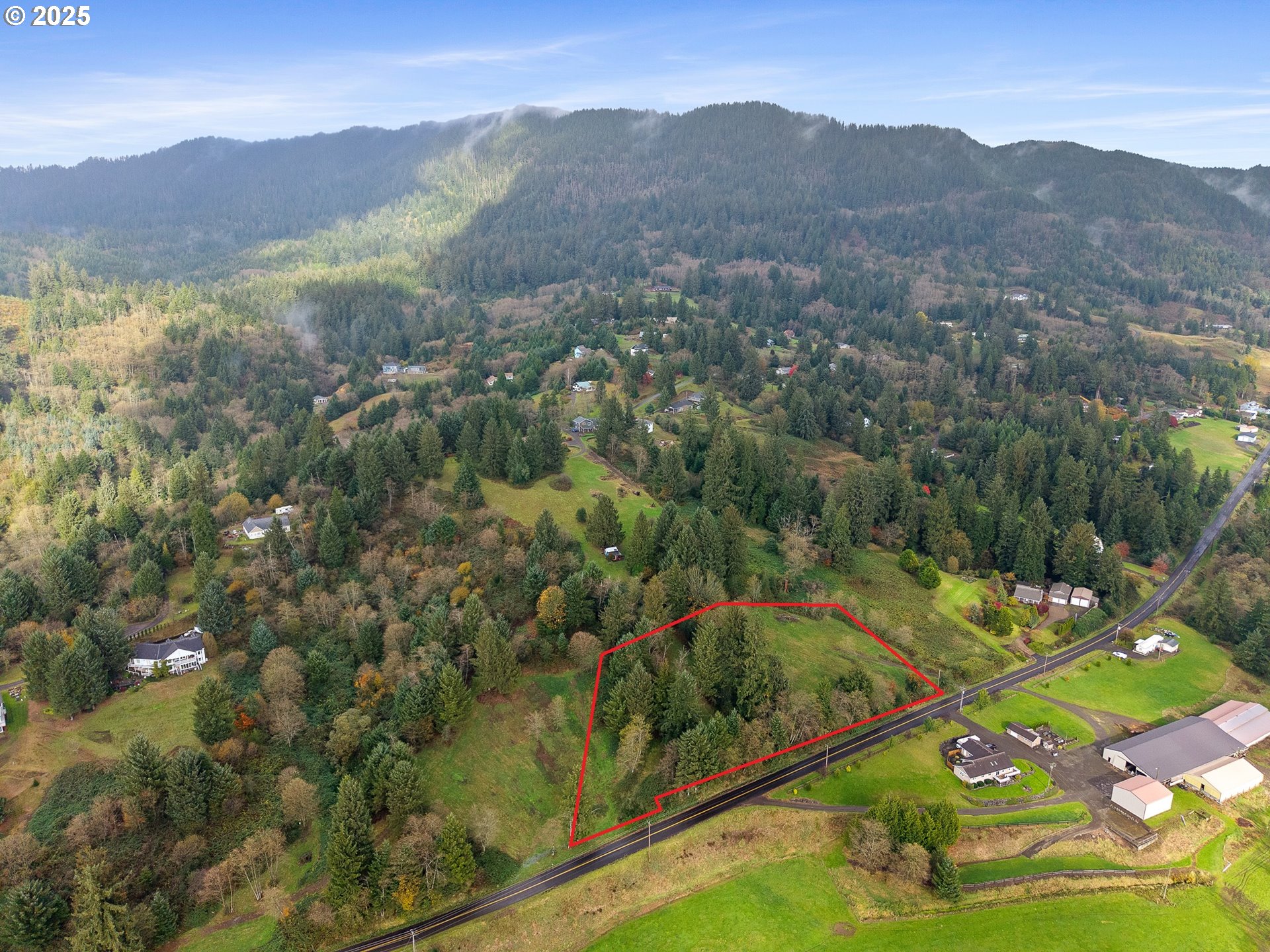 502 Sollie Smith Road North Tillamook, OR 97141 - Photo 4 of 7 a view of a mountain with a lush green hillside