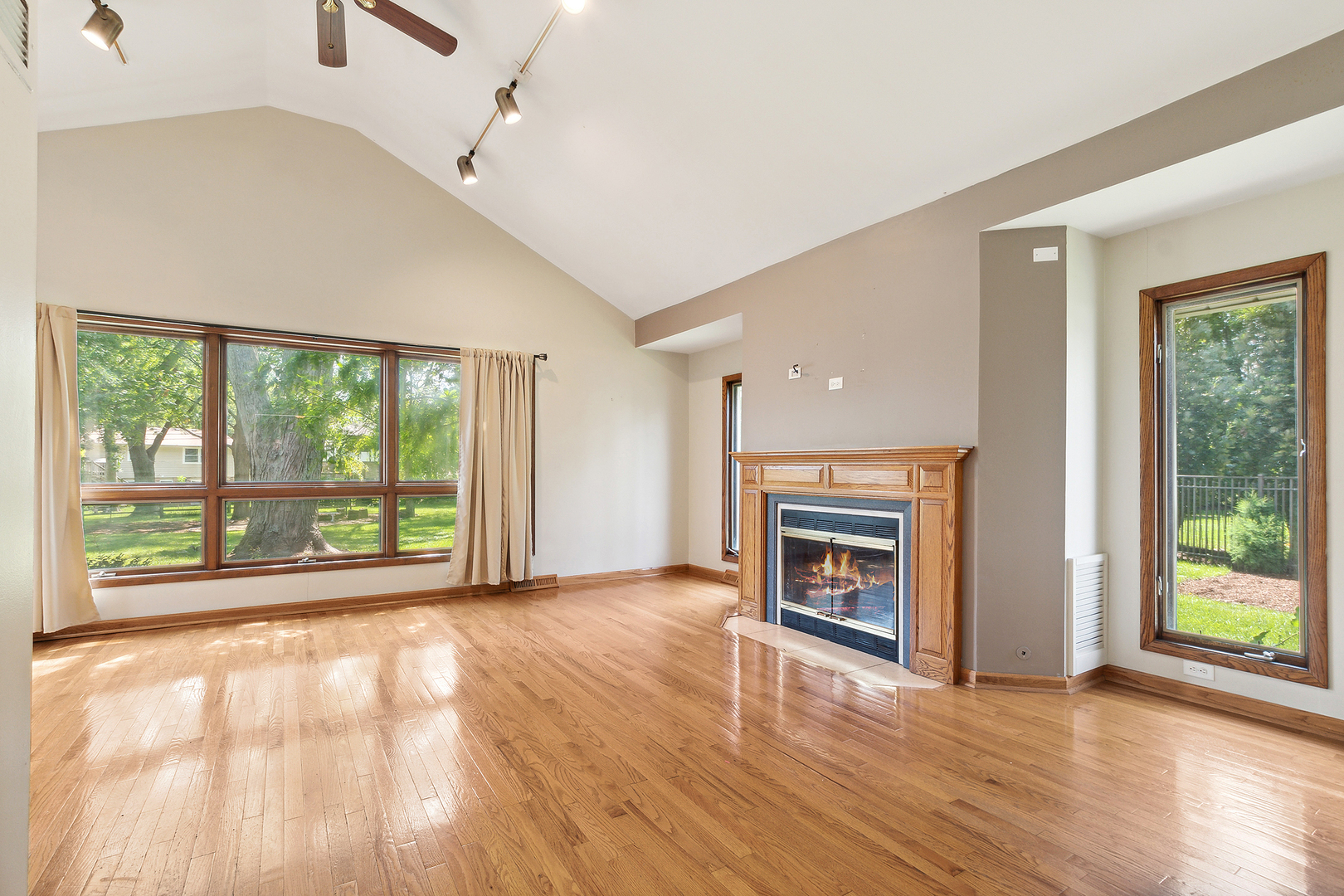 509 Hawthorne Road Frankfort, IL 60423 - Photo 11 of 36 a view of an empty room with wooden floor windows and a fireplace