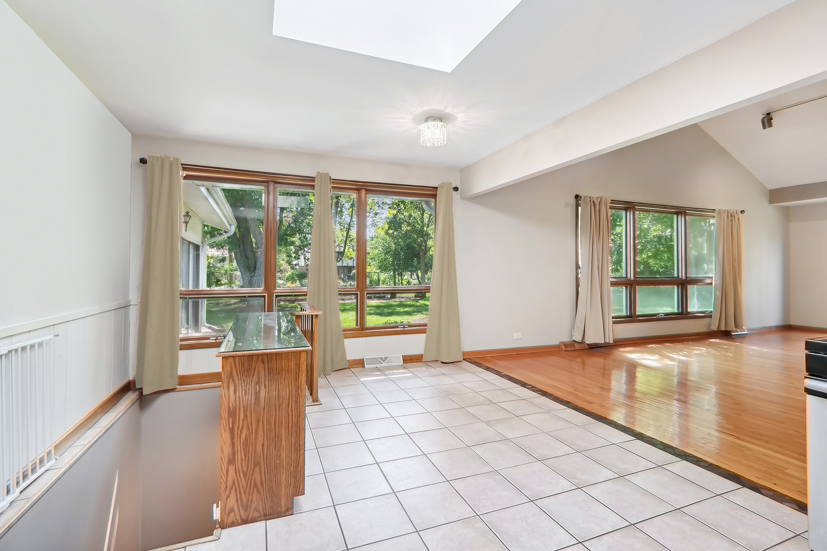 509 Hawthorne Road Frankfort, IL 60423 - Photo 15 of 36 a view of an empty room with wooden floor and a window