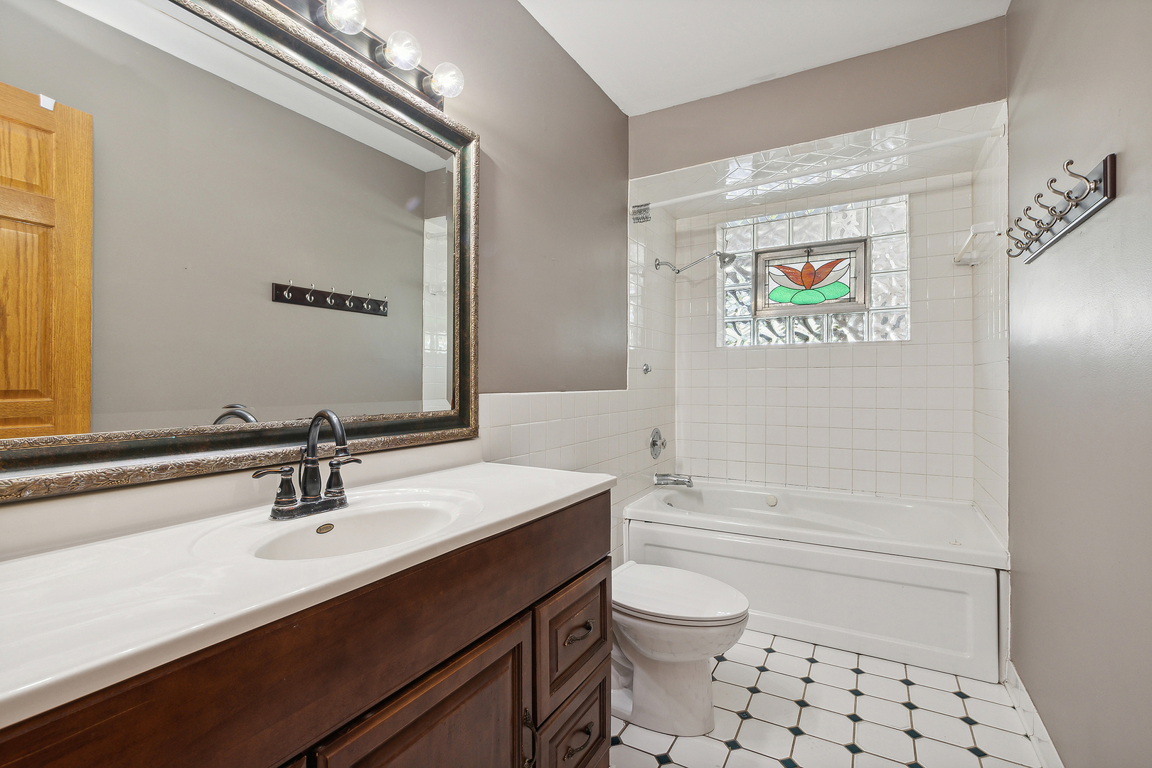 509 Hawthorne Road Frankfort, IL 60423 - Photo 18 of 36 a bathroom with a sink a toilet a shower and a mirror