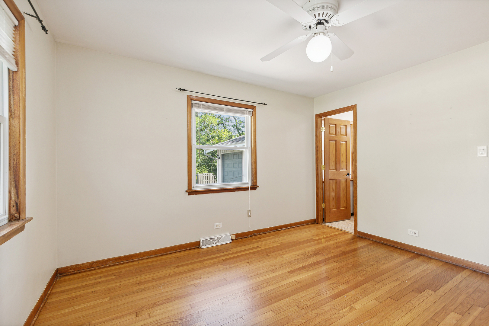 509 Hawthorne Road Frankfort, IL 60423 - Photo 20 of 36 a view of an empty room with wooden floor and a window