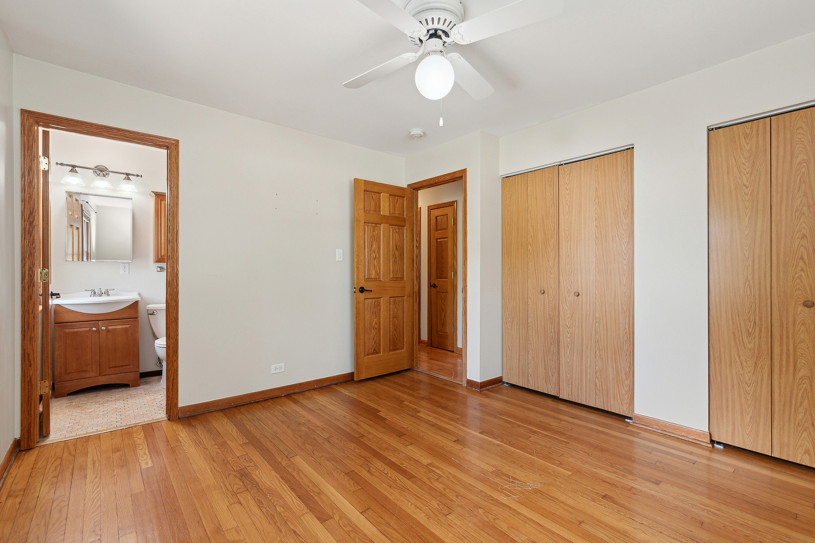 509 Hawthorne Road Frankfort, IL 60423 - Photo 21 of 36 a view of a room with wooden floor and a ceiling fan
