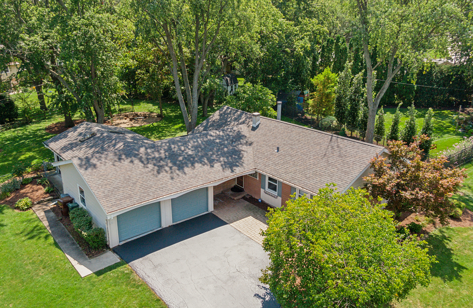 509 Hawthorne Road Frankfort, IL 60423 - Photo 30 of 36 a view of a wooden house with a yard and large trees