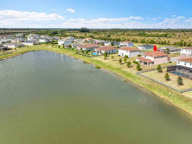 a view of a swimming pool with a lounge chairs