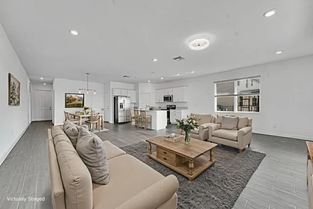 a kitchen with stainless steel appliances a refrigerator a stove top oven a sink and dishwasher