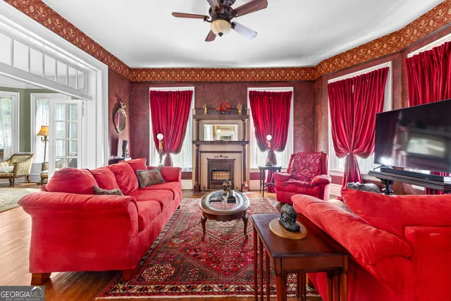 a kitchen with stainless steel appliances granite countertop a stove a washer and dryer next to a window