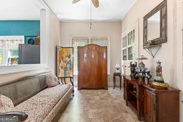 a living room with furniture and a window