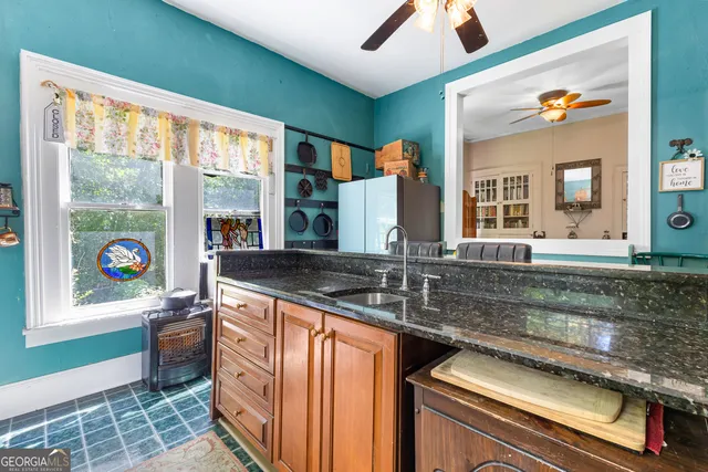 a view of a livingroom with furniture and a fireplace
