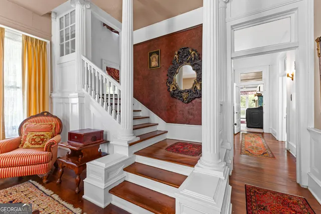 a bedroom with a bed and a fireplace