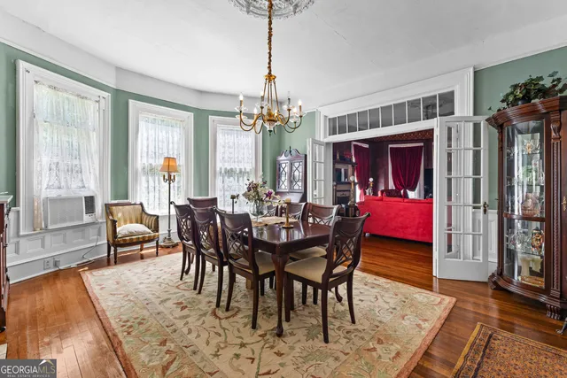 a bedroom with a bed and a dresser in it