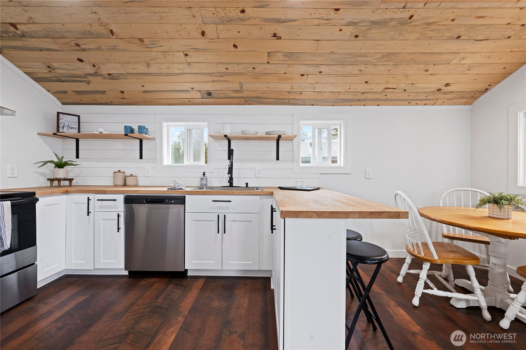 26502 Ridge Avenue Ocean Park, WA 98640 - Photo 14 of 30 a kitchen with a sink cabinets and wooden floor