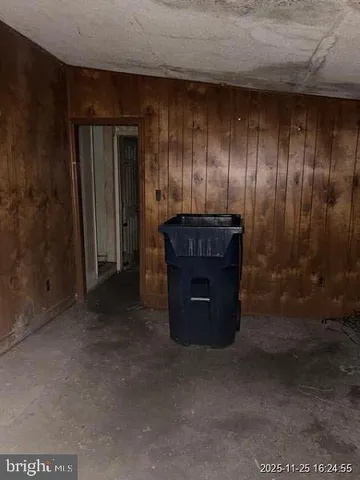 a room with a fireplace and cabinets
