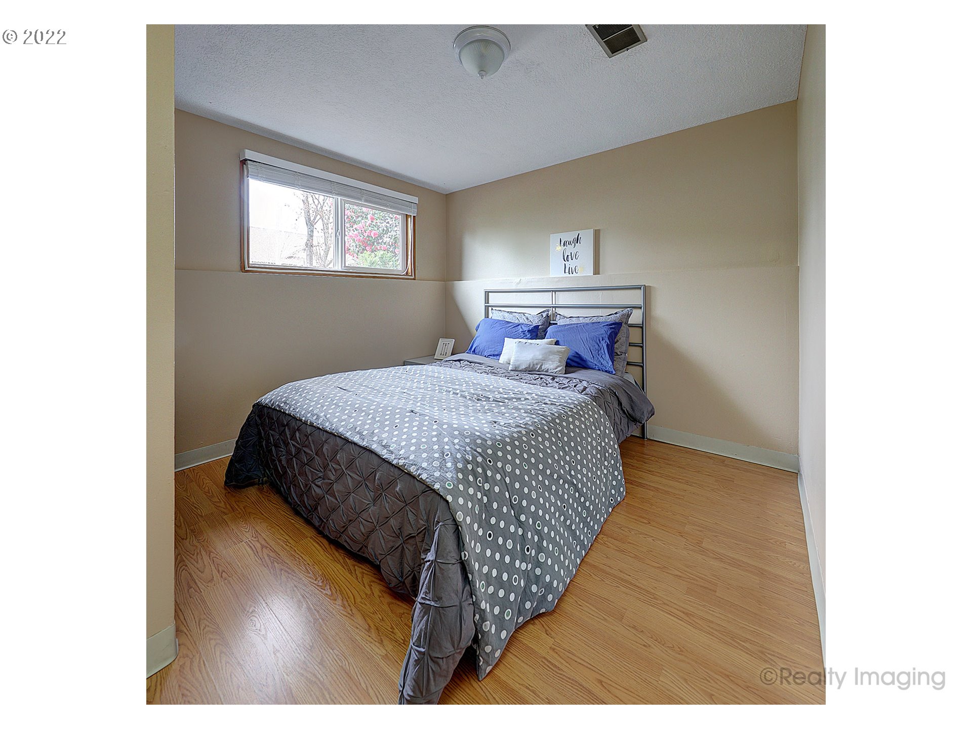 13936 Southeast Taylor Street Portland, OR 97233 - Photo 15 of 24 a bedroom with a bed and window