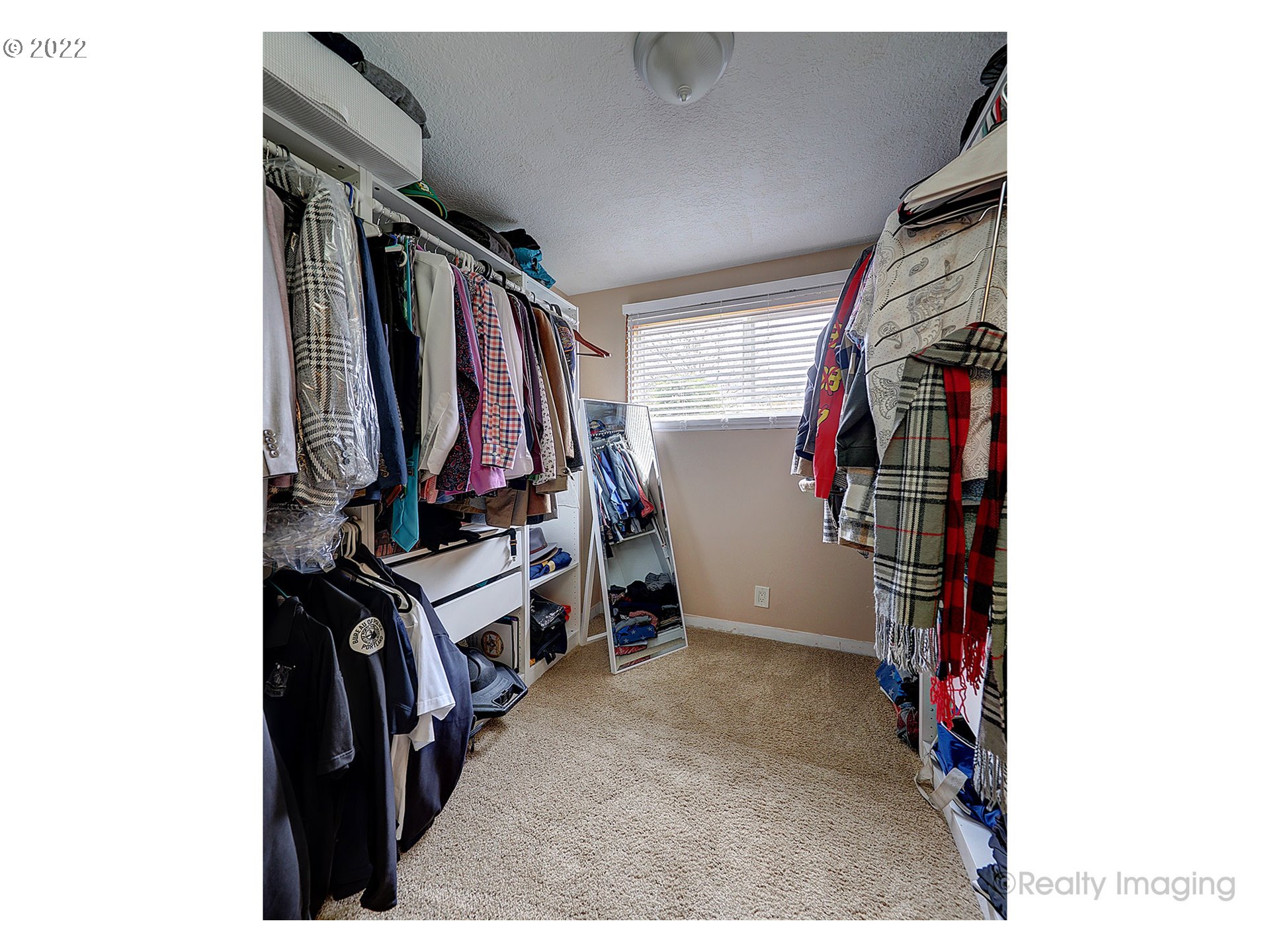 13936 Southeast Taylor Street Portland, OR 97233 - Photo 16 of 24 a view of walk in closet with clothes and shoes