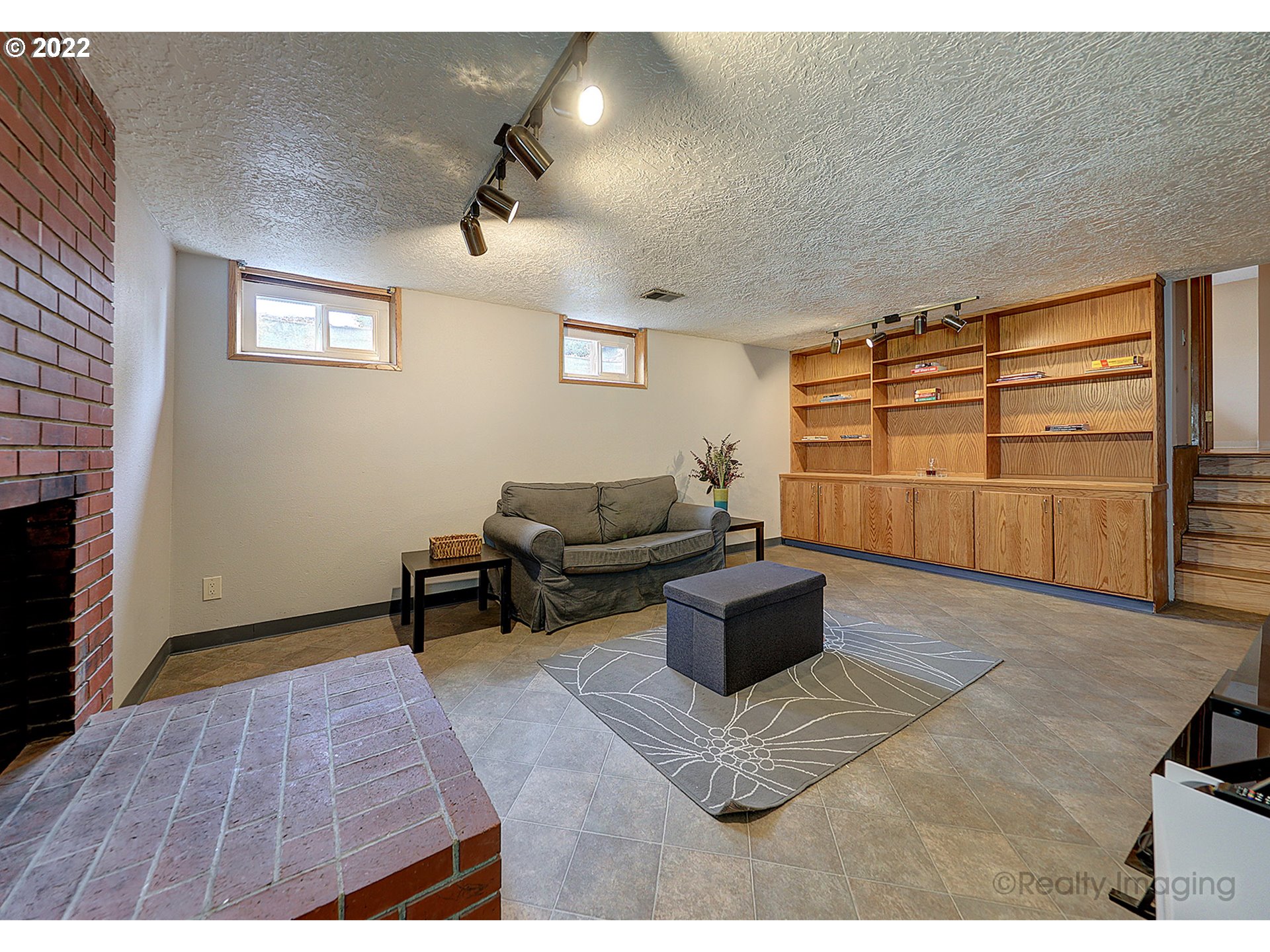 13936 Southeast Taylor Street Portland, OR 97233 - Photo 19 of 24 a living room with furniture and a fireplace