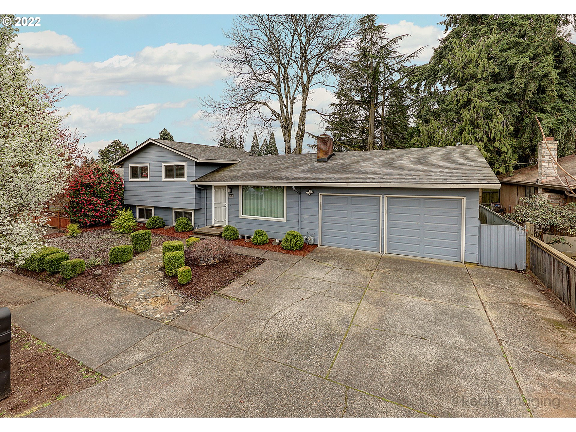 13936 Southeast Taylor Street Portland, OR 97233 - Photo 2 of 24 a view of a house with a patio and a yard