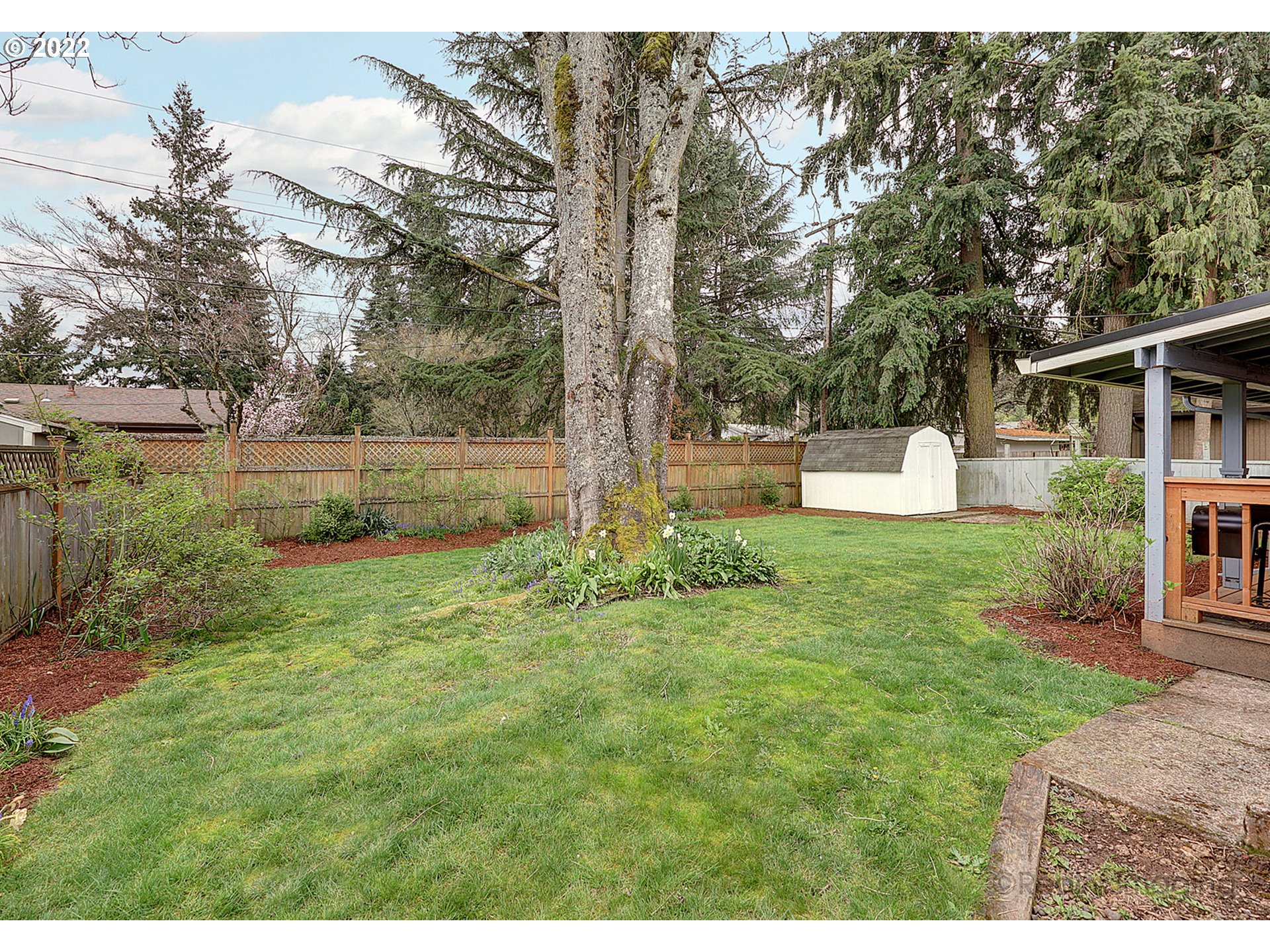 13936 Southeast Taylor Street Portland, OR 97233 - Photo 23 of 24 a backyard of a house with lots of green space