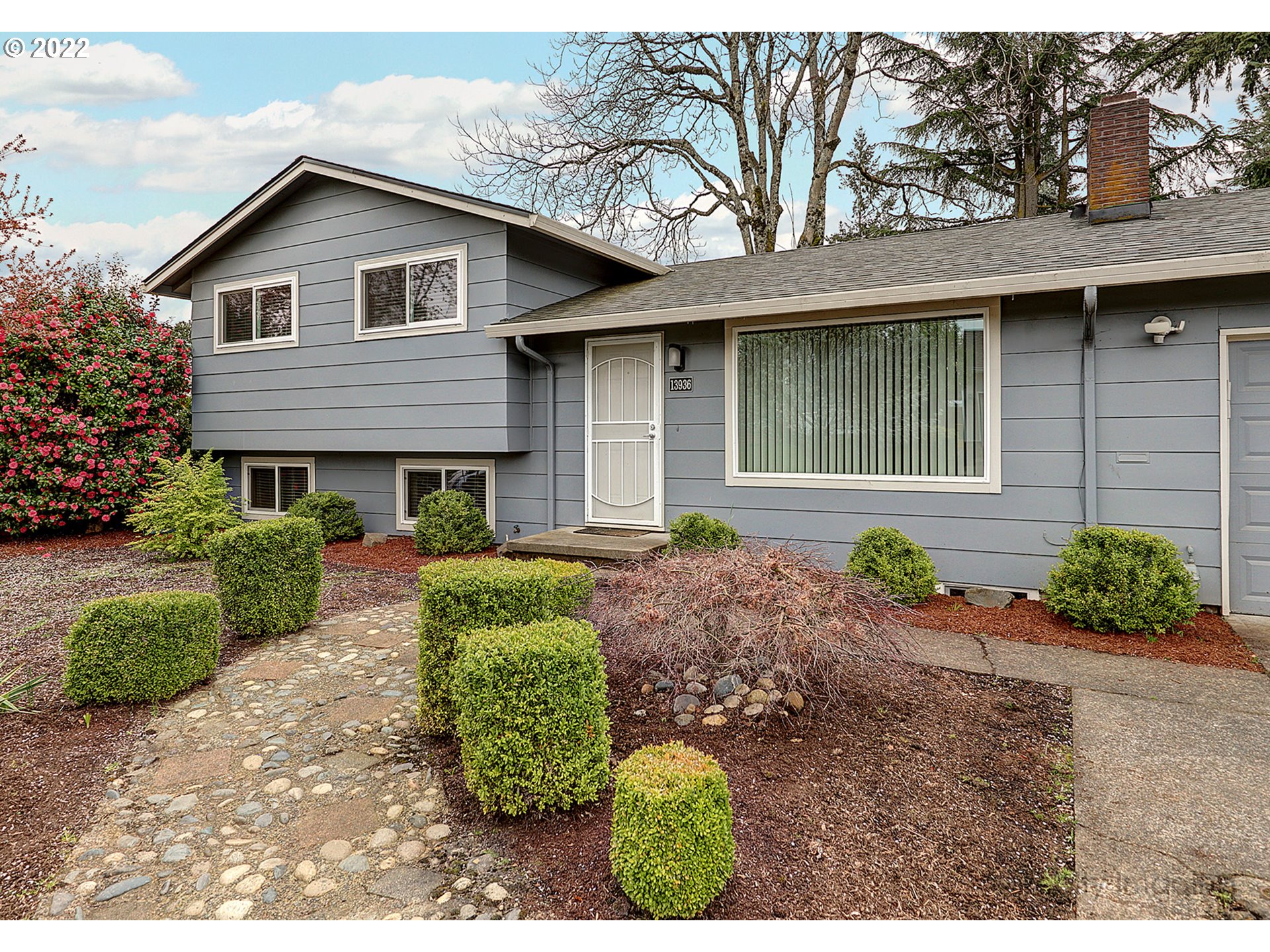 13936 Southeast Taylor Street Portland, OR 97233 - Photo 3 of 24 a front view of a house with garden