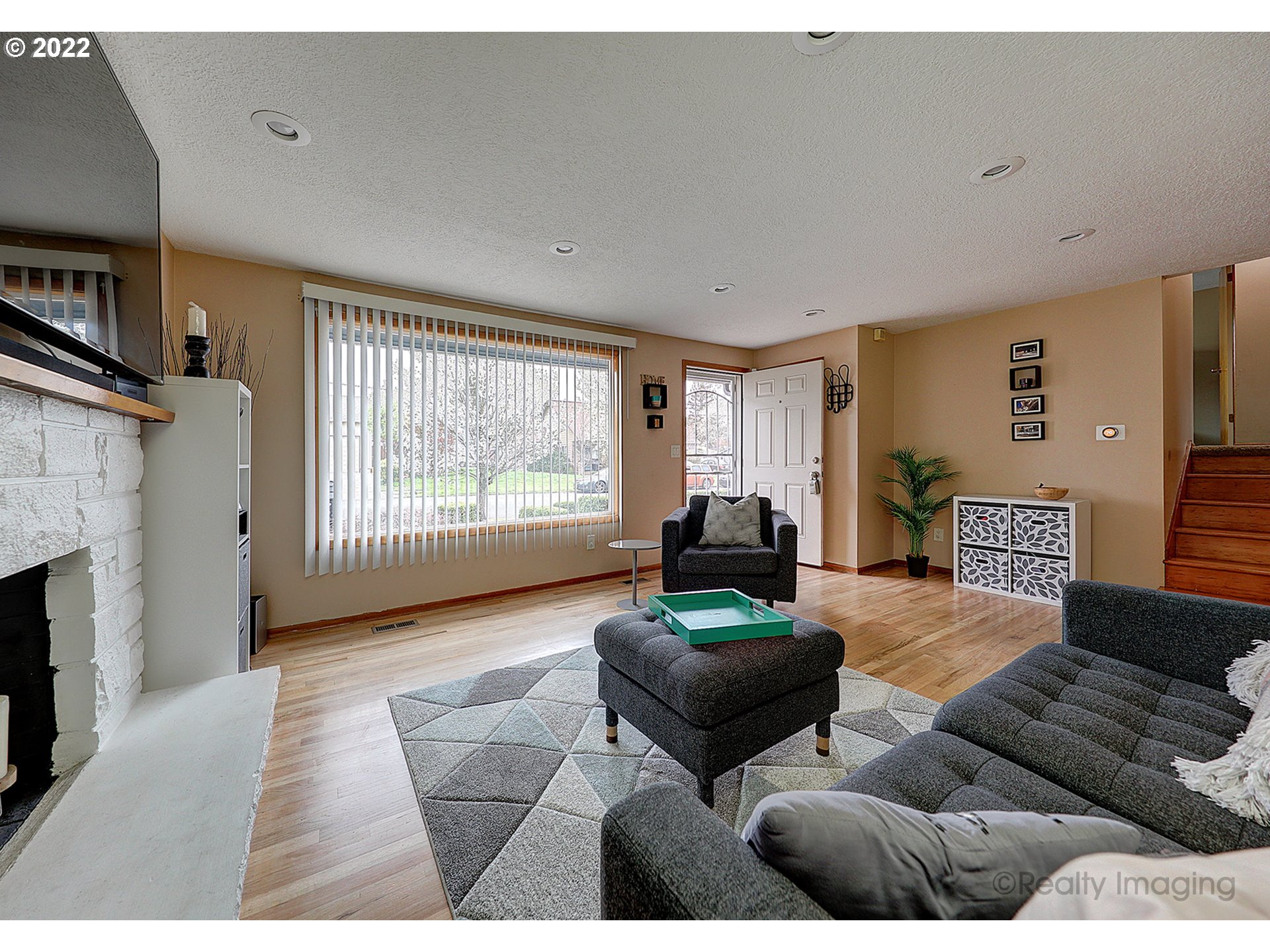 13936 Southeast Taylor Street Portland, OR 97233 - Photo 5 of 24 a living room with furniture and a fireplace