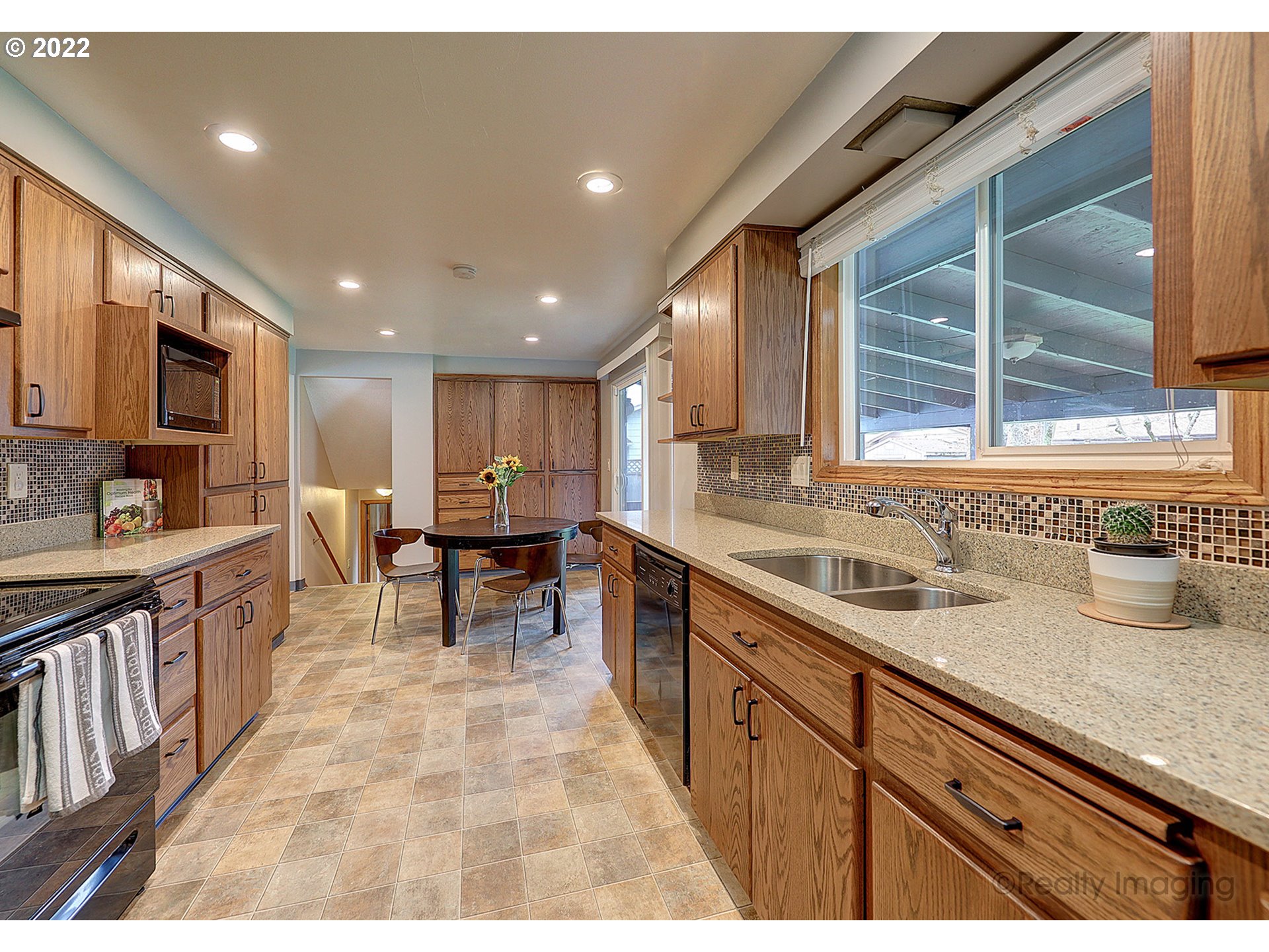 13936 Southeast Taylor Street Portland, OR 97233 - Photo 8 of 24 a view of a kitchen with kitchen island granite countertop lots of counter top space and stainless steel appliances