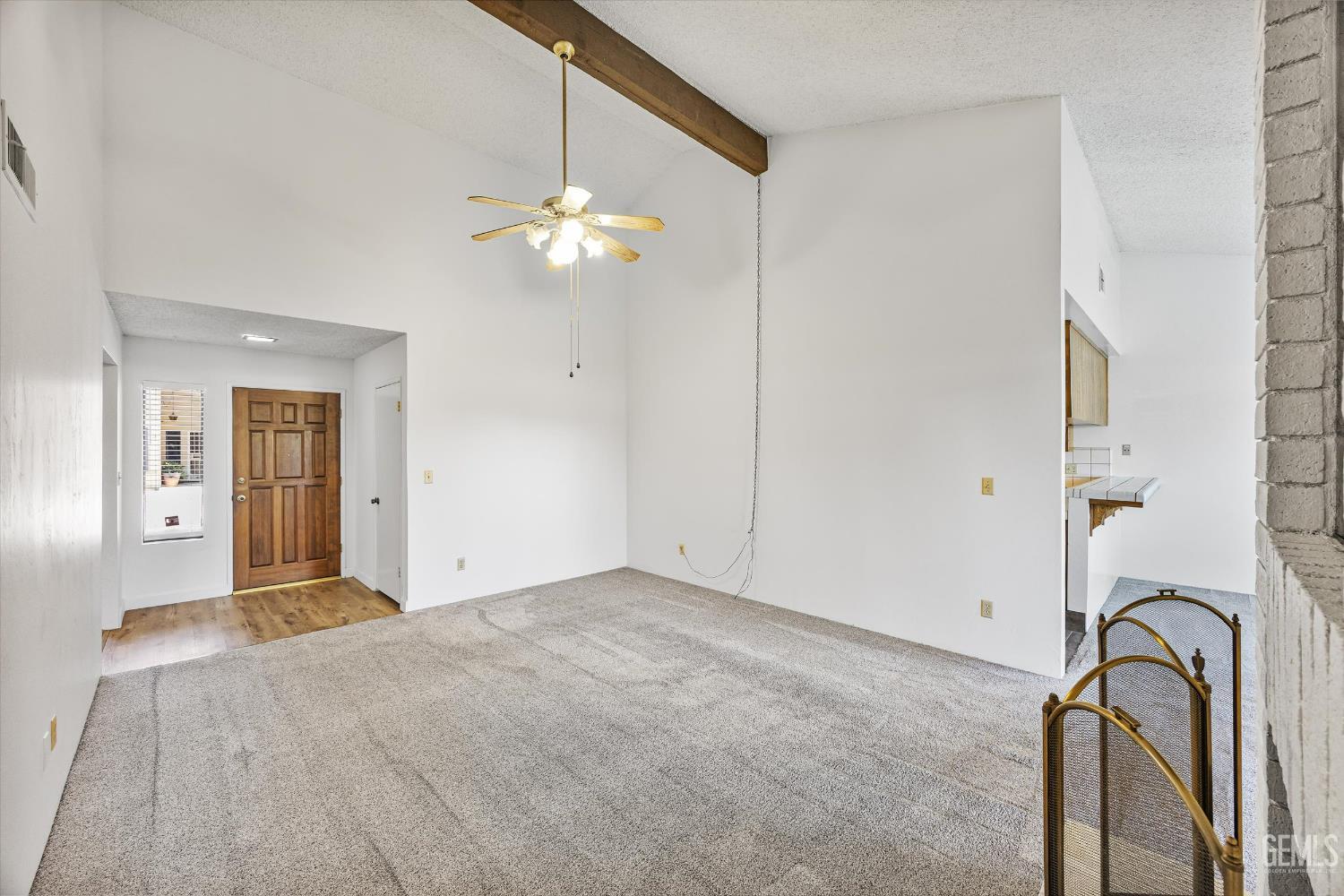 Undisclosed Address Bakersfield, CA 93308 - Photo 11 of 37 a view of a chandelier fan and hardwood floor