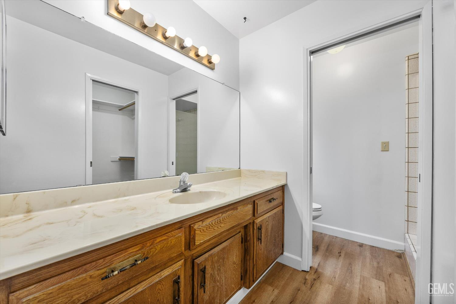 Undisclosed Address Bakersfield, CA 93308 - Photo 22 of 37 a bathroom with a sink and a mirror