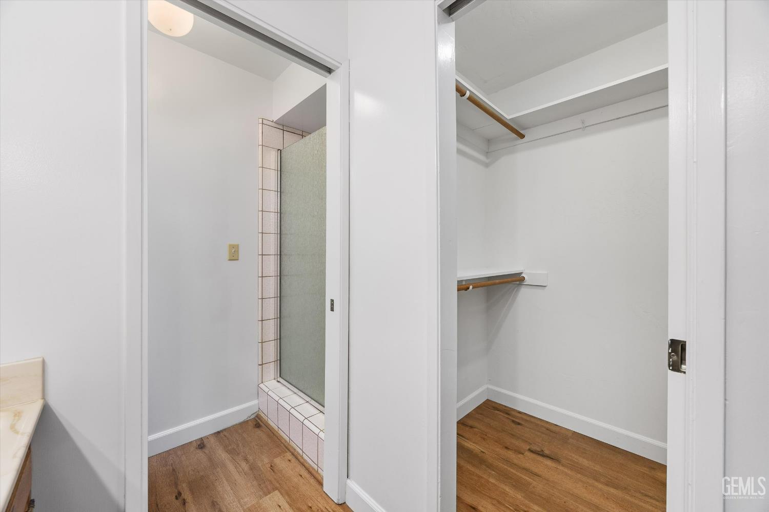 Undisclosed Address Bakersfield, CA 93308 - Photo 23 of 37 a view of walk in closet with empty racks