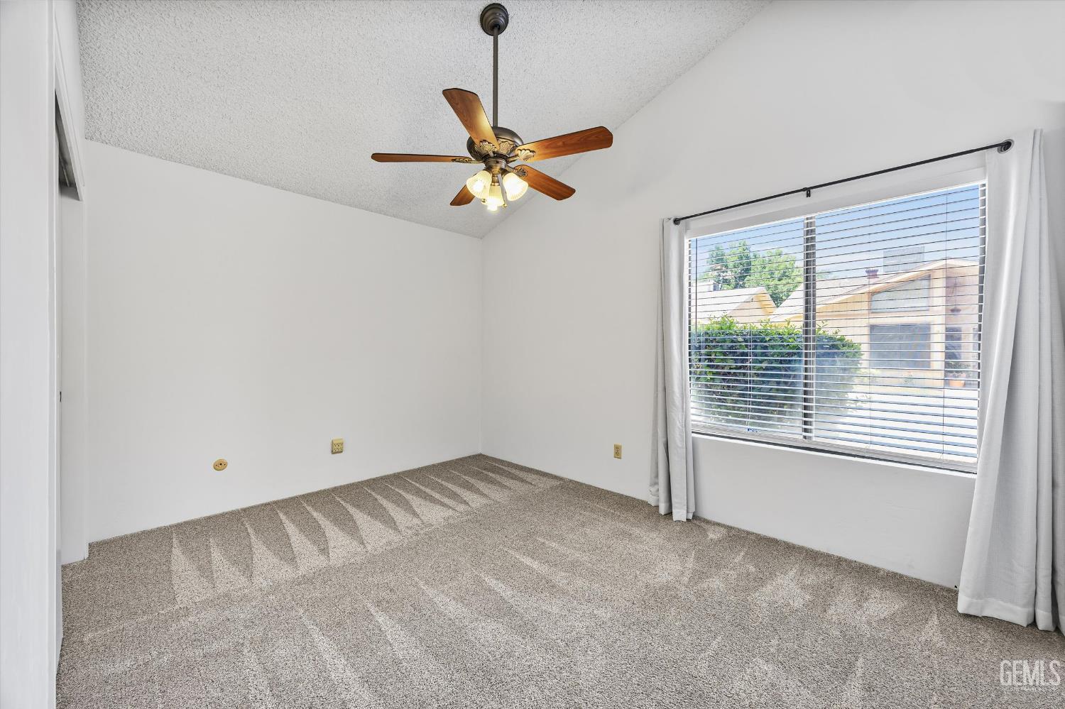 Undisclosed Address Bakersfield, CA 93308 - Photo 25 of 37 a view of an empty room with a window