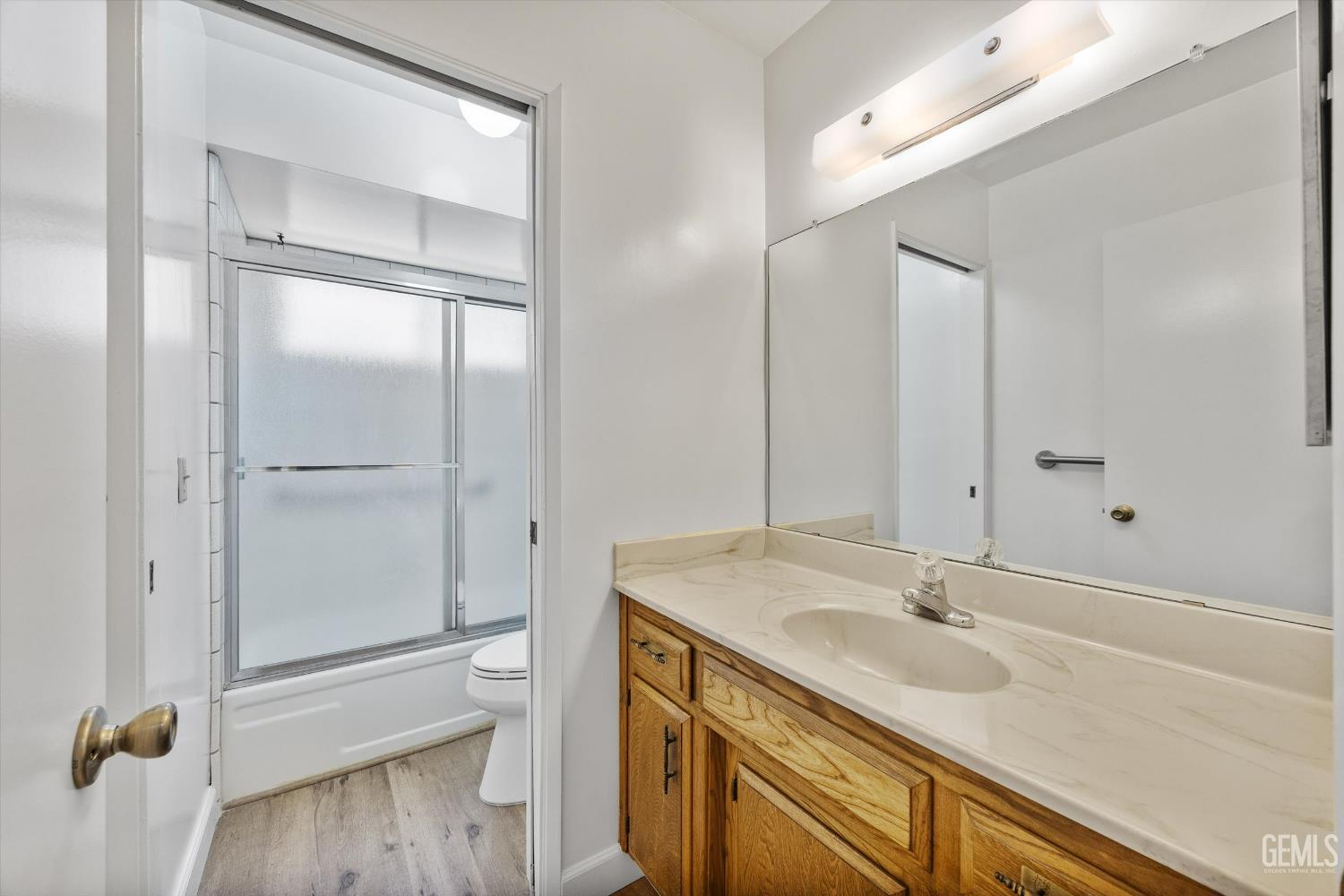 Undisclosed Address Bakersfield, CA 93308 - Photo 27 of 37 a bathroom with a sink double vanity and a mirror