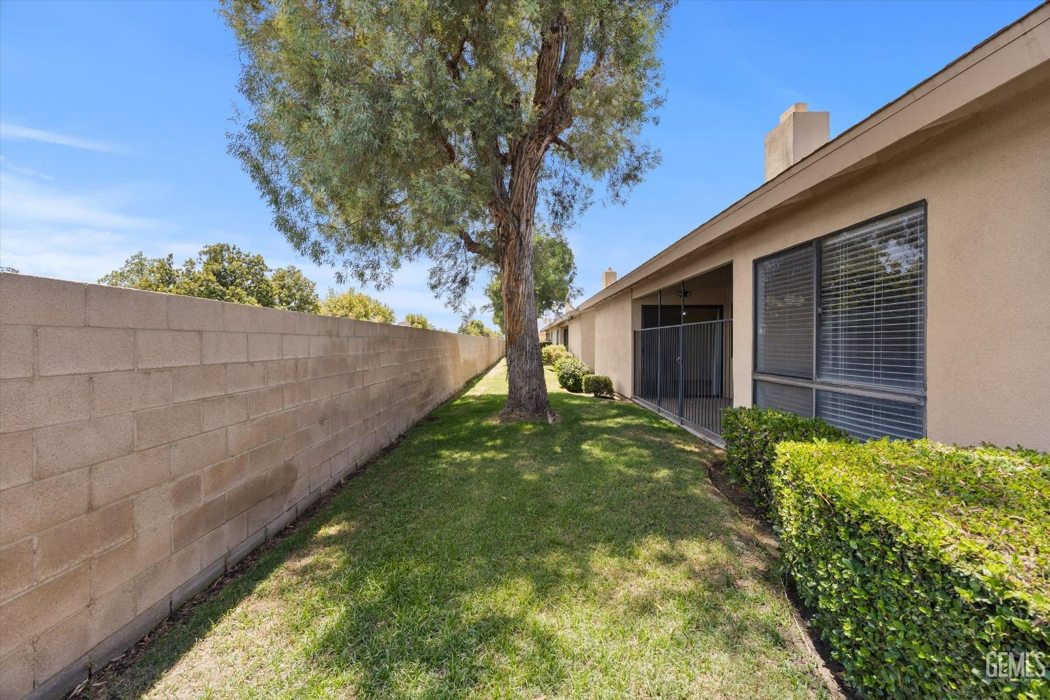 Undisclosed Address Bakersfield, CA 93308 - Photo 31 of 37 a backyard of a house with lots of green space