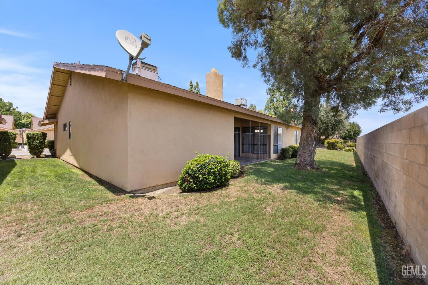 Undisclosed Address Bakersfield, CA 93308 - Photo 33 of 37 a backyard of a house with lots of green space